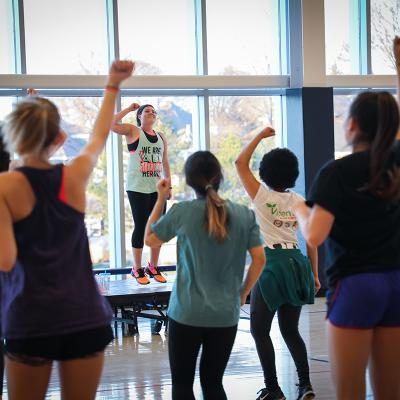 Students at a Zumba class in the gym