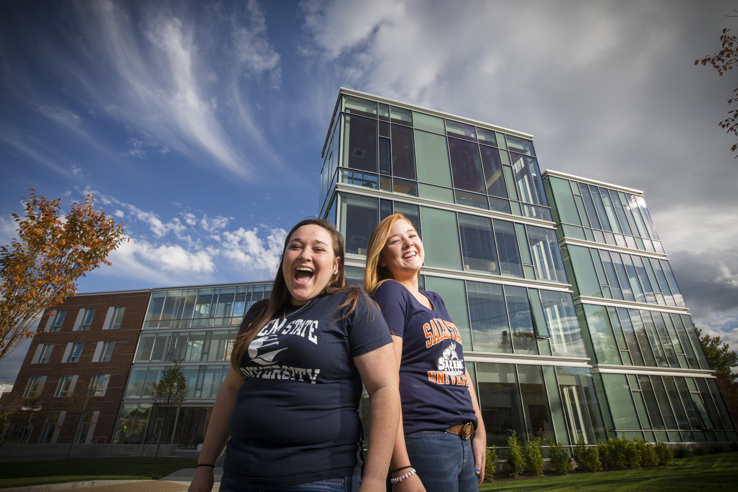 Two girls smiling in front of Viking Hall