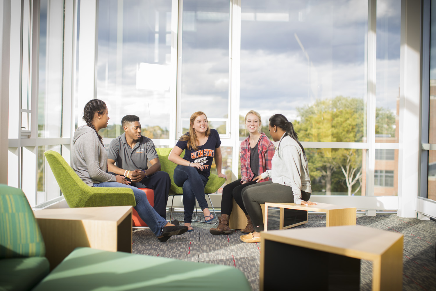 Students together in a common area chatting.