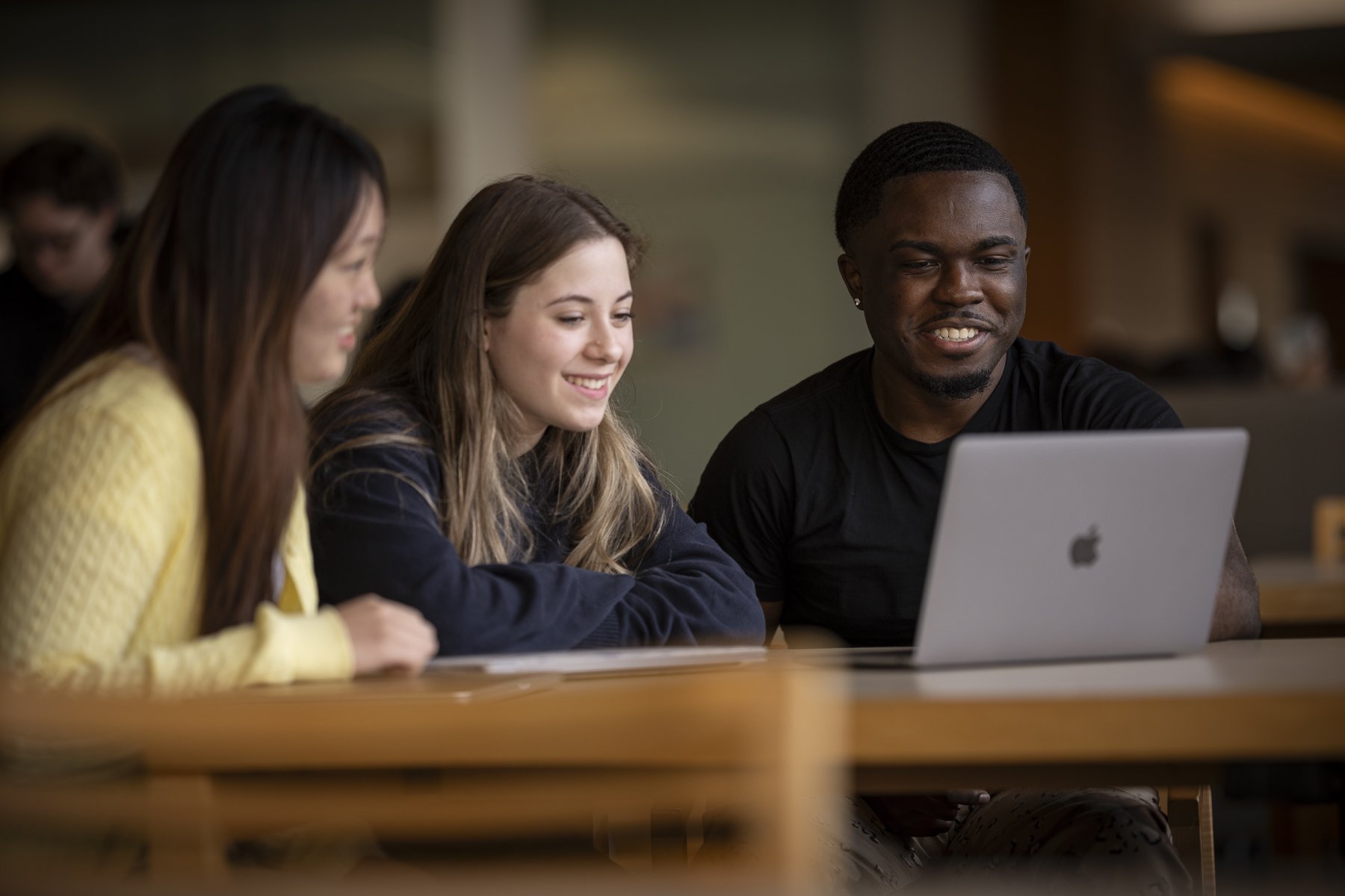 3 Students around a computer