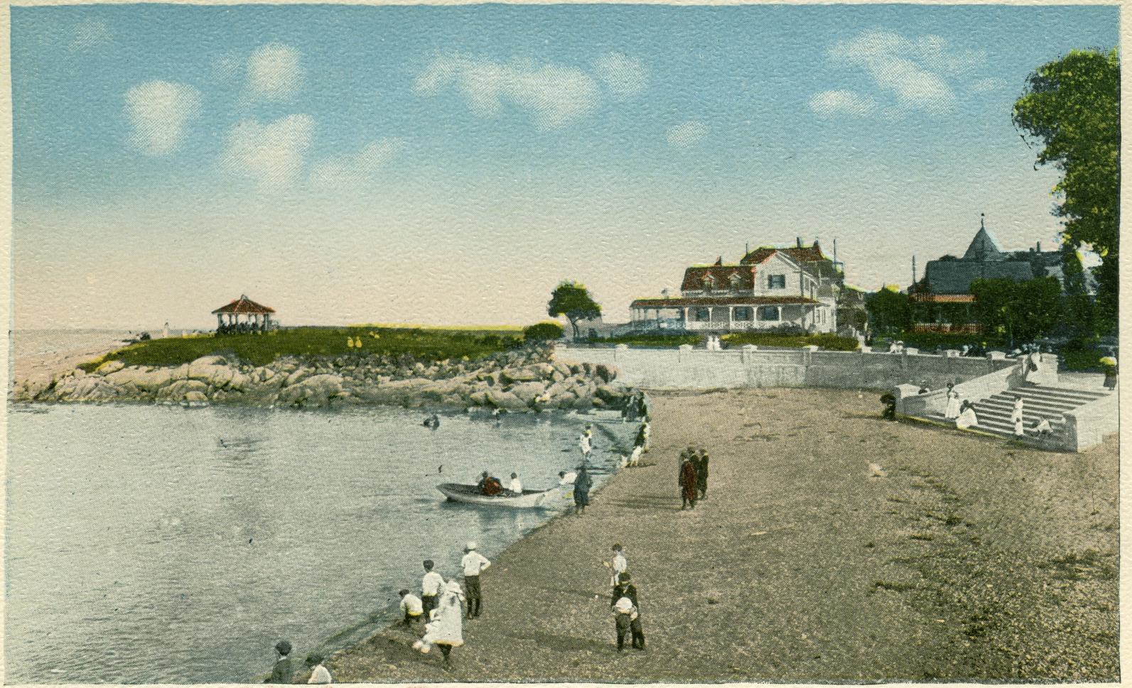 People on the beach in nineteenth century clothing