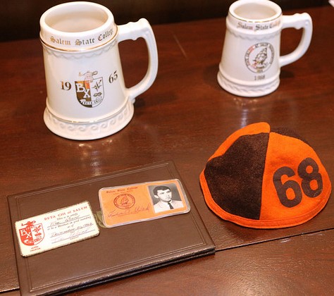 Alumni Weekend 50th Reunion photo of class mugs, beanie and fraternity membership cards 1968