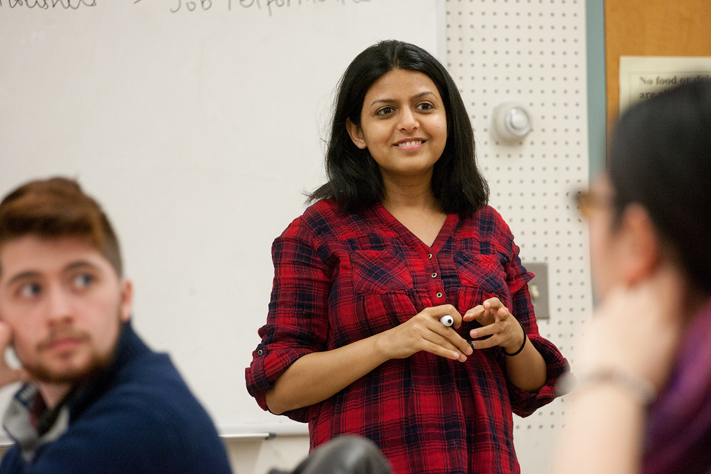 A student standing at the front of the class.