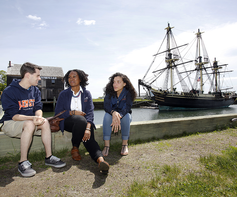 Students in front of FRIENDSHIP in Salem Harbor