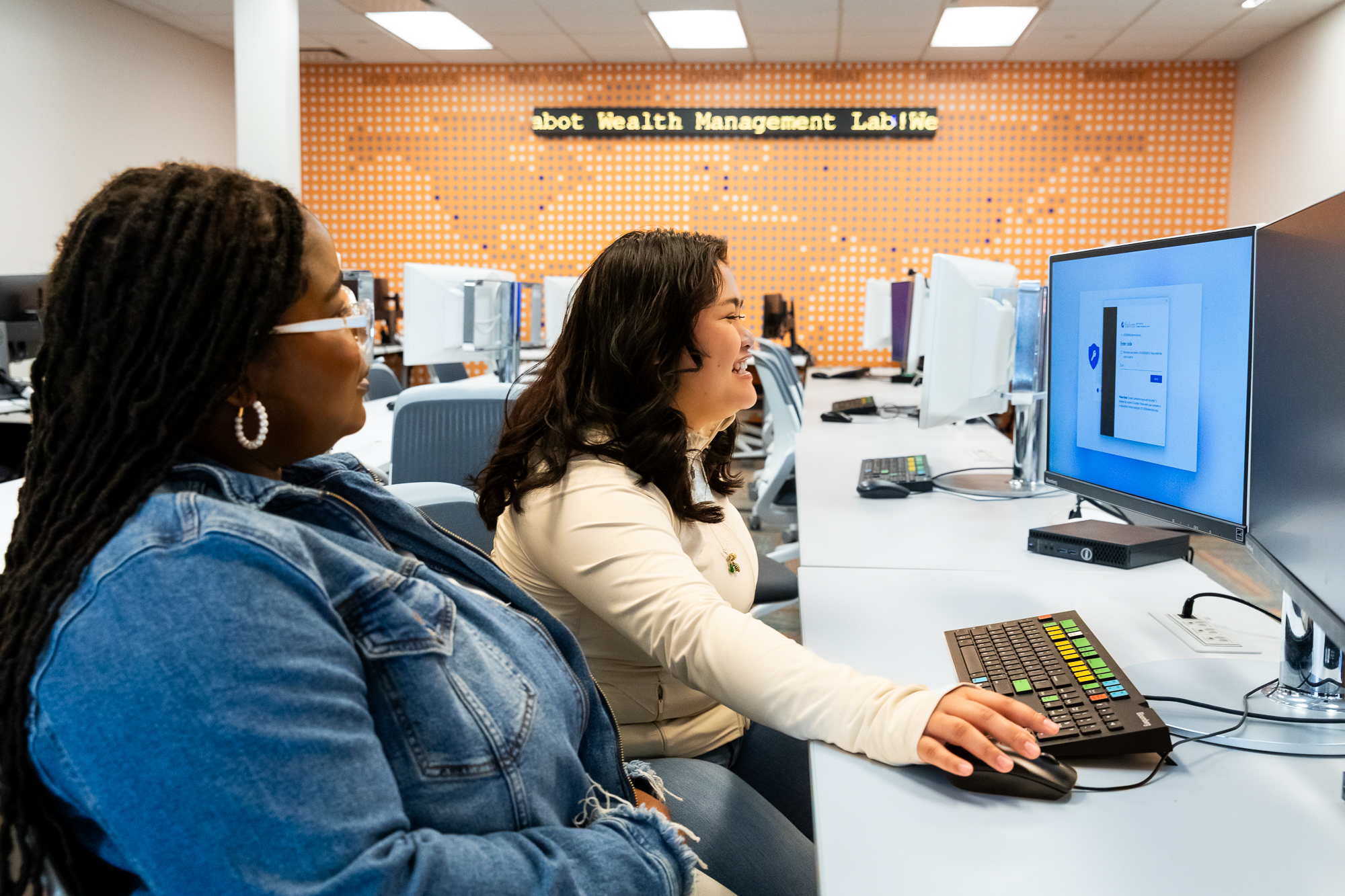 Two students at a computer