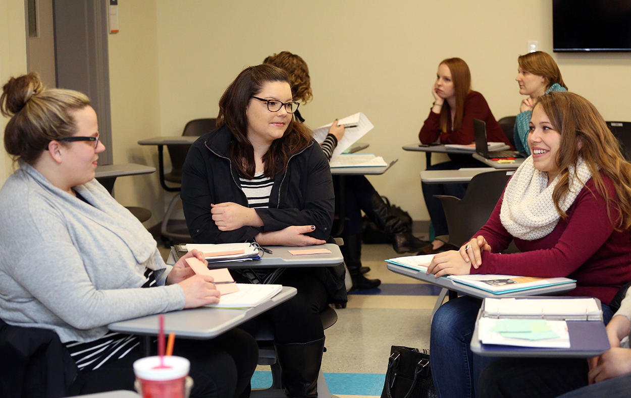 Students in the school of graduate studies in a class discussion