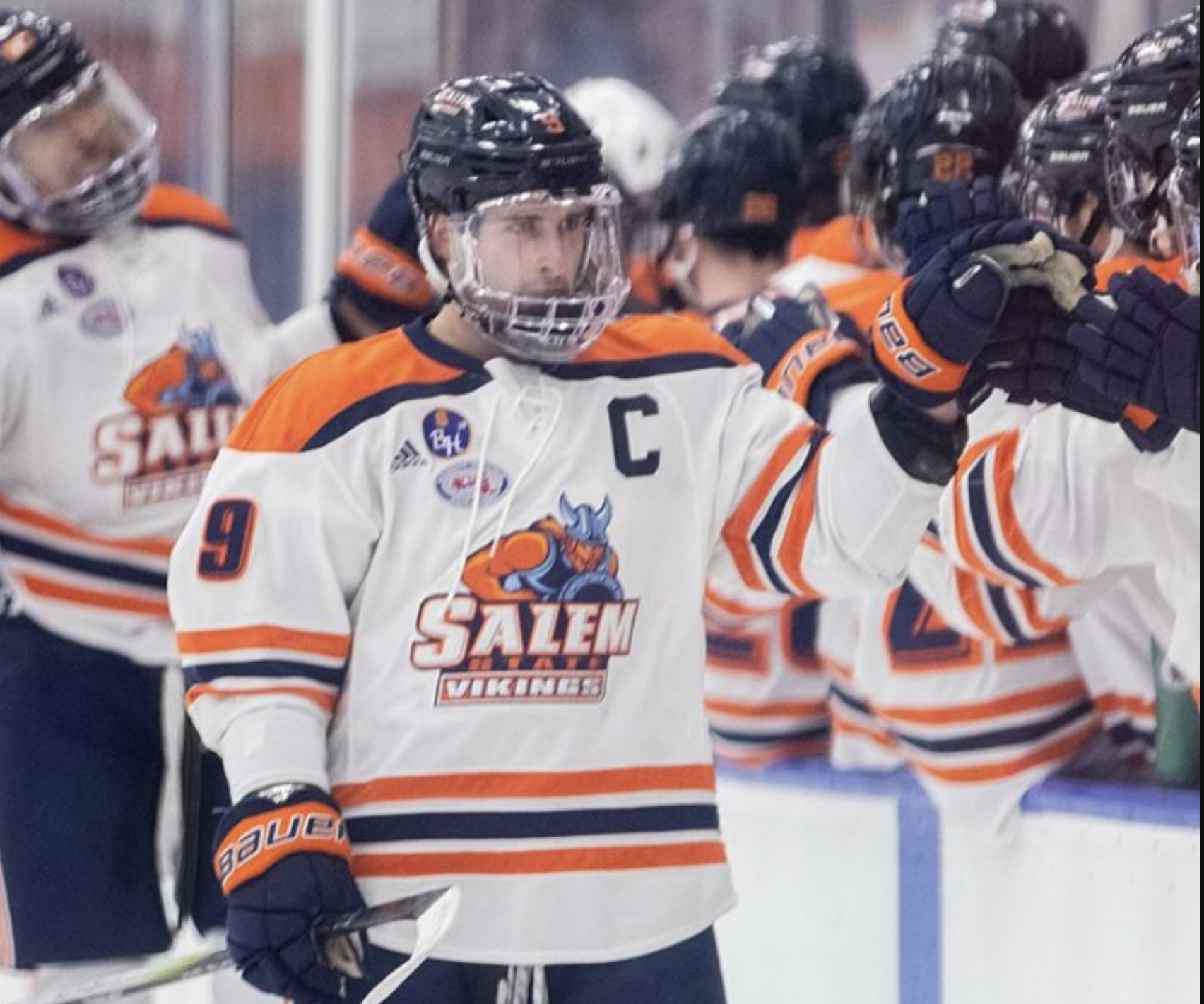 Hockey player Luke Day giving a fist bump