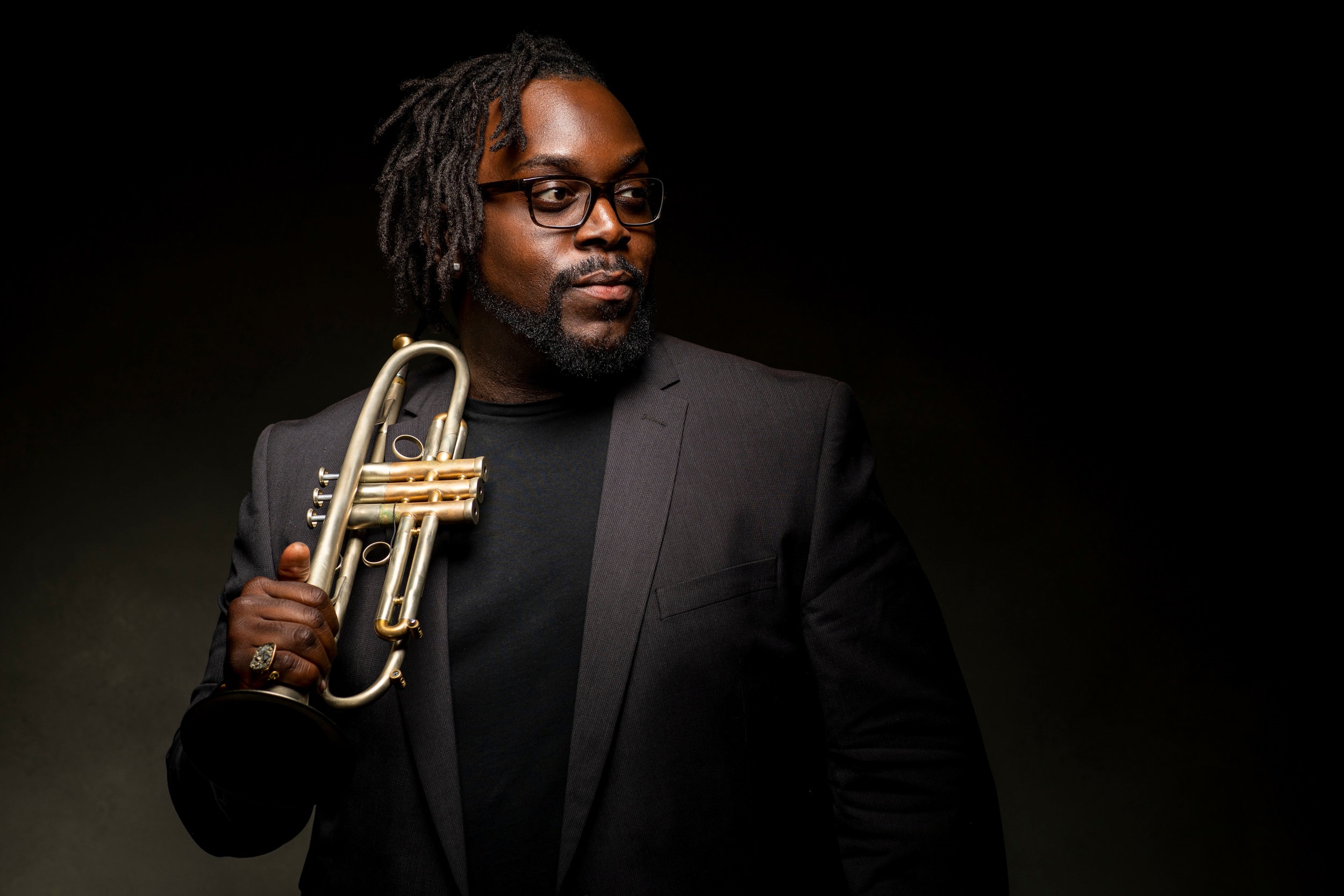 Musician Marquis Hill holding trumpet