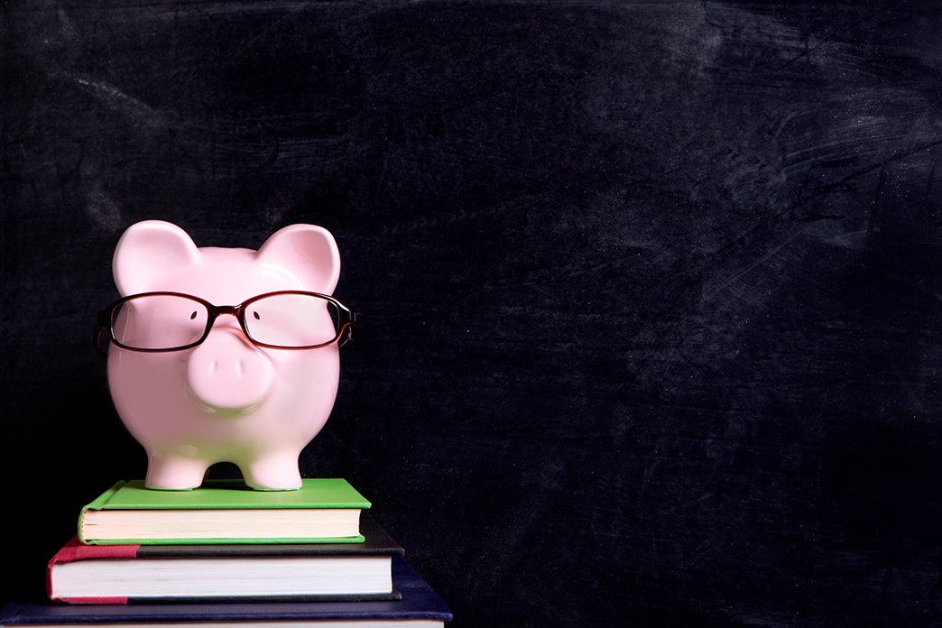 Piggy bank on textbooks