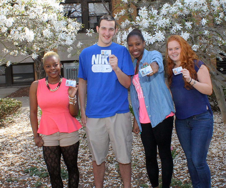 Viking students holding their ClipperCards in front of them