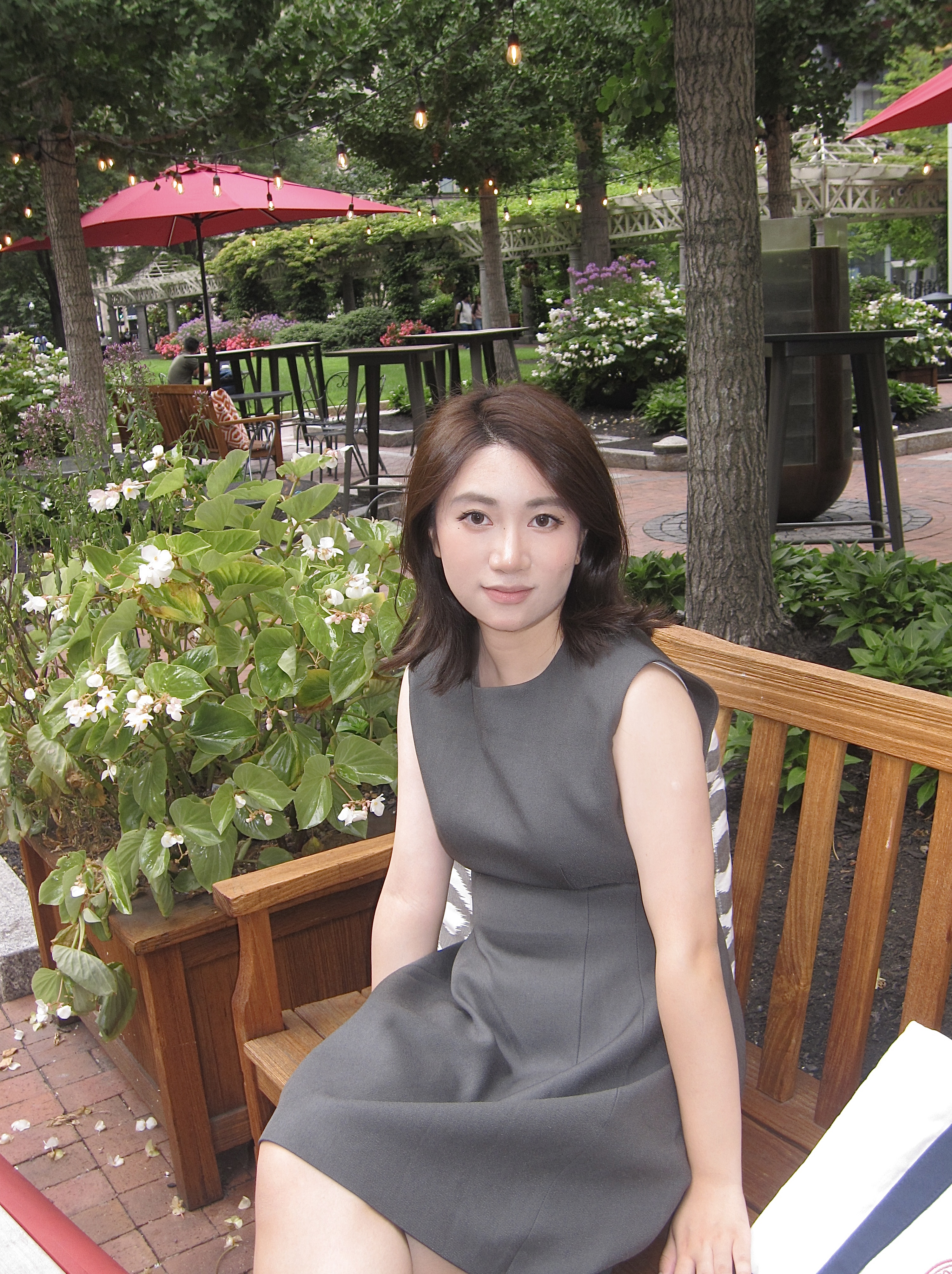 Yufei Hu sits in a chair