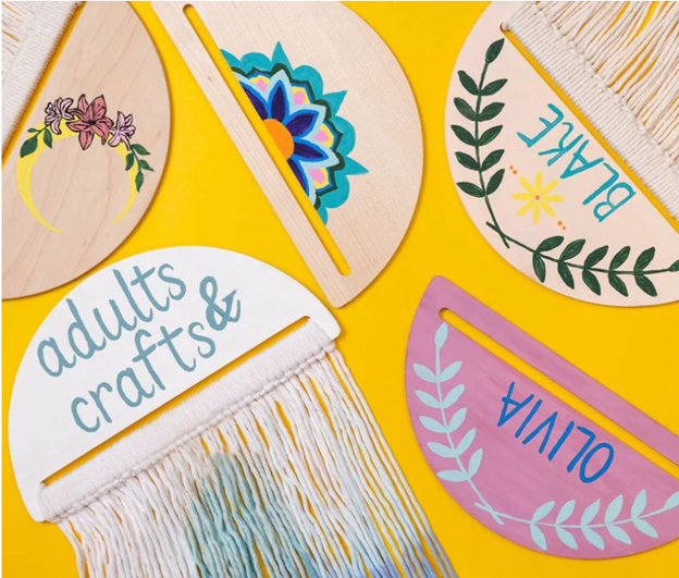 Wooden signs with names and different painted shapes