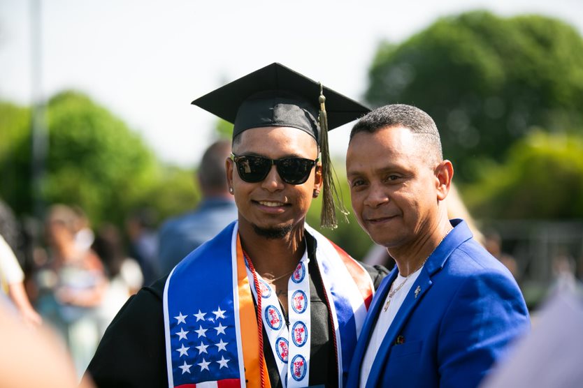 Graduate and family members pose together after ceremony