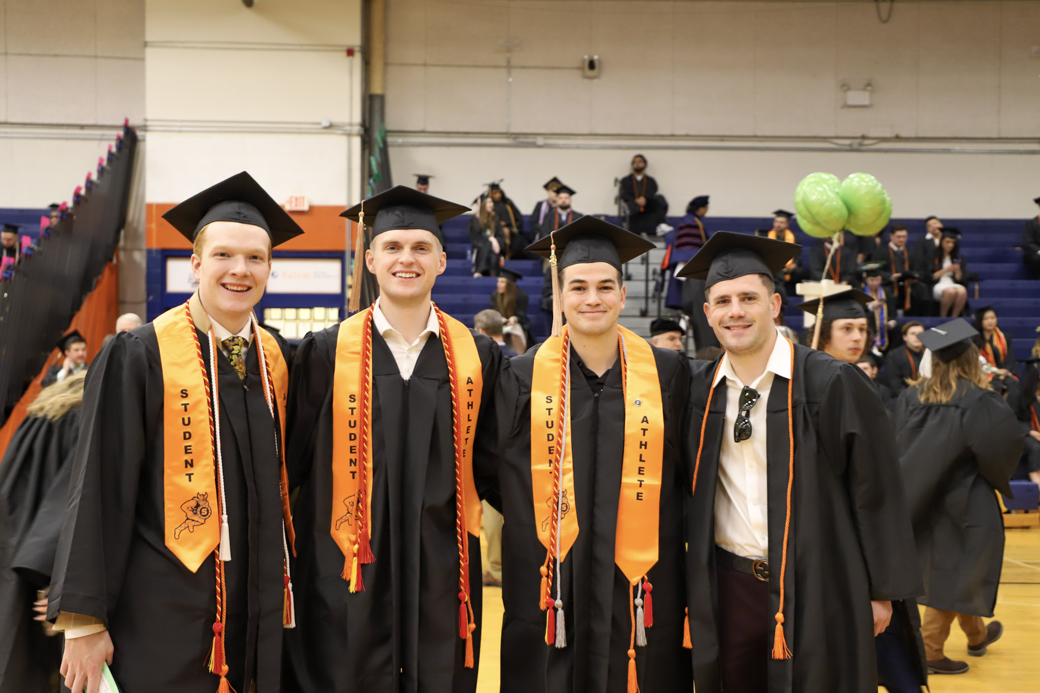 Students with athlete stoles at graduation