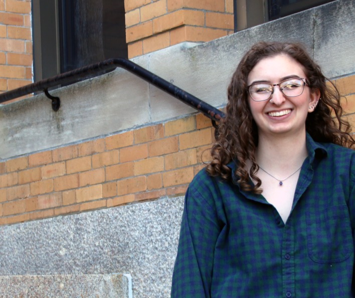 Salem State Student Anna Snyder in front of the Sullivan Building