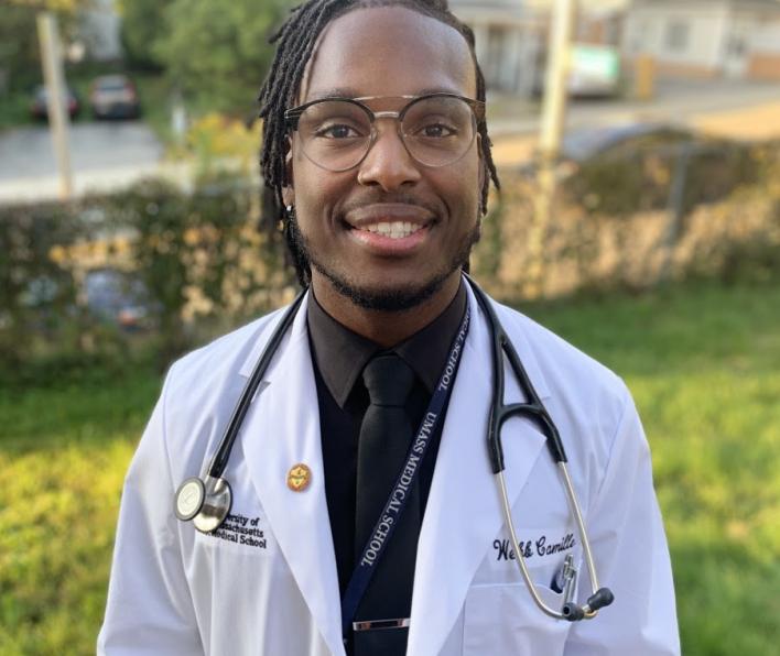 Webb Camille '16 in a medical student coat and stethescope