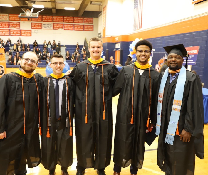 A group of graduate school students at commencement