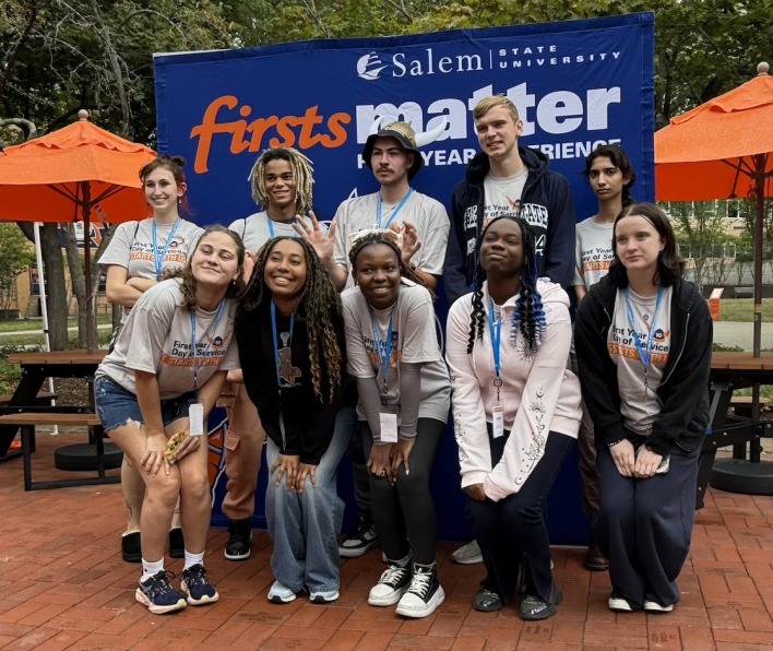 Group of FYDS students in front of the "Firsts Matter" banner