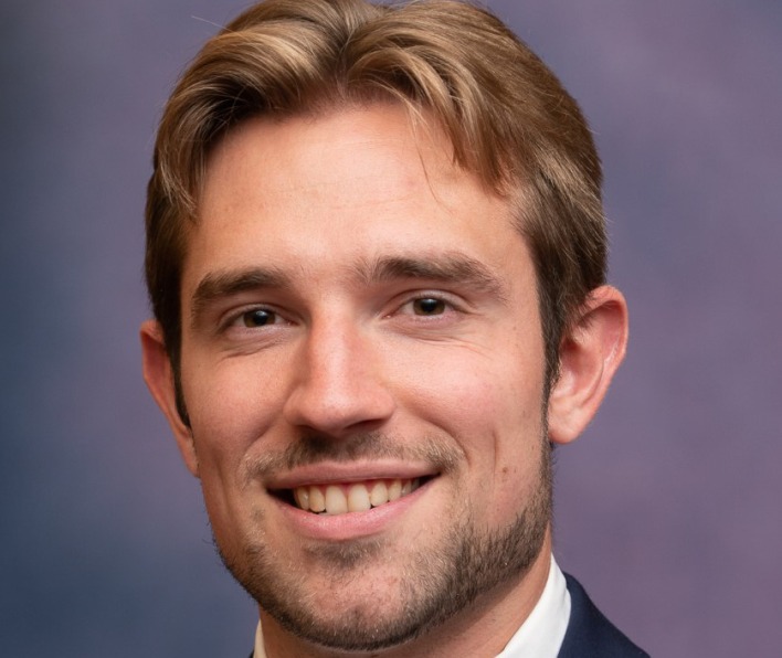 A headshot of Tristan Smith, a 2018 graduate of Salem State.