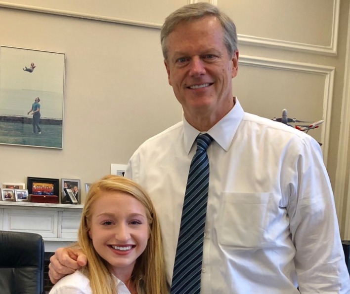 Kelly Govoni, a 2018 Salem State alum, poses with Massachusetts Governor Charlie Baker. 