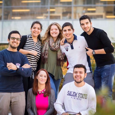 salem college tour A group of seven students hanging out in front of the library in the fall
