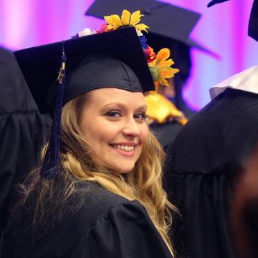 Female graduate at commencement ceremony