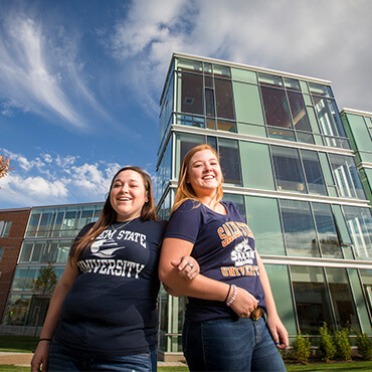 Two tour guides prepare to lead a tour of Viking Hall