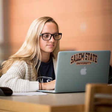 A student finds a quiet spot to study and stay connected on campus