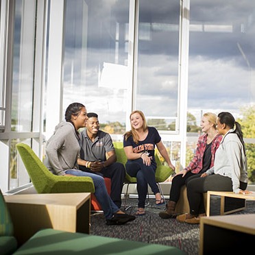 Students in a circle in Viking hall