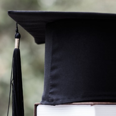 Graduation Cap on book