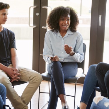 Getty Image of Female Leading Discussion