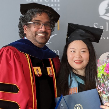 Professor and CIE student at commencement