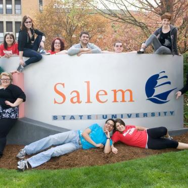A group of students pose in front of the SSU sign