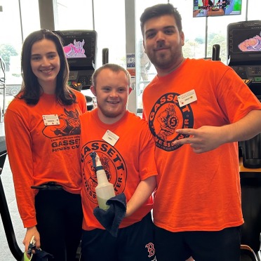 Three Gassett Fitness employees posing at the fitness center