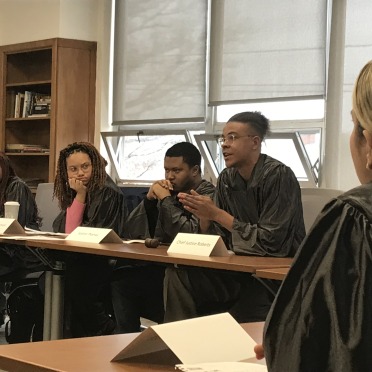 Students in a moot court simulation