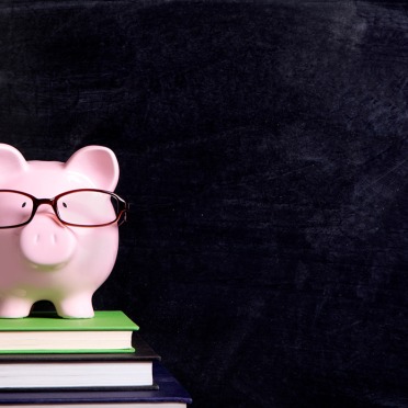 Piggy bank on textbooks