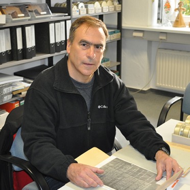 Professor Chris Mauriello at a desk