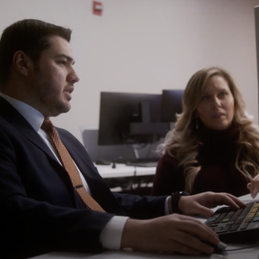 A male student and a female student in the Bloomberg lab.