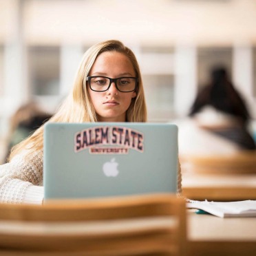 A student studying on her laptop