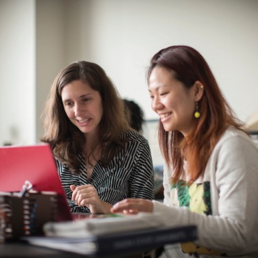 Two students at a desk