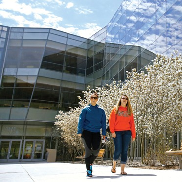 Girls walking in front of library