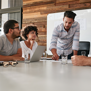 Three adults in a meeting