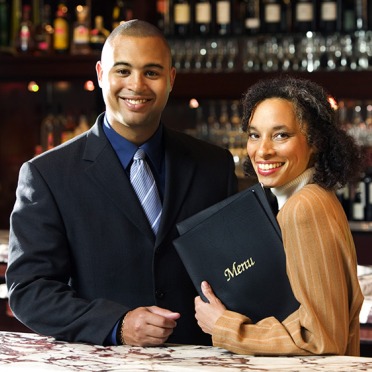 Two professionals in a restaurant bar