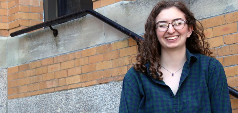 Salem State Student Anna Snyder in front of the Sullivan Building