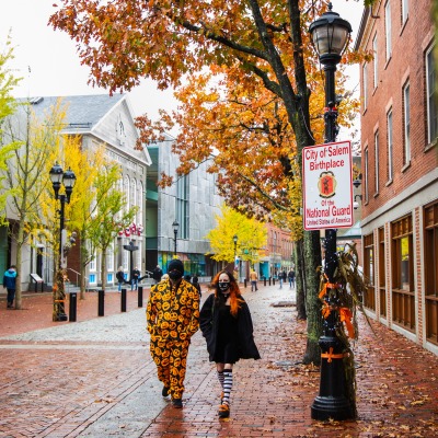 Two students wearing costumers exploring downtown Salem