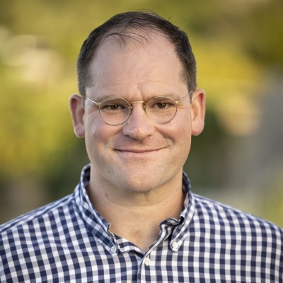 Brian Schubmehl wearing a white and blue checkered shirt