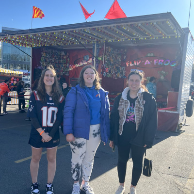 CIS students smiling at a fair