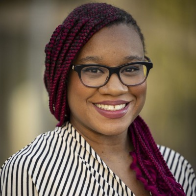Lataya Ferguson-Jean wearing a white and black striped shirt