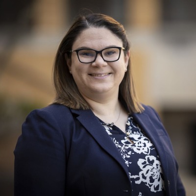 Nicole Healy in front of Sullivan building wearing blue blazer