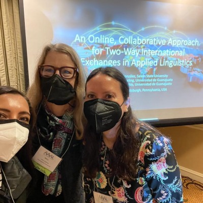 Three faculty members wearing masks